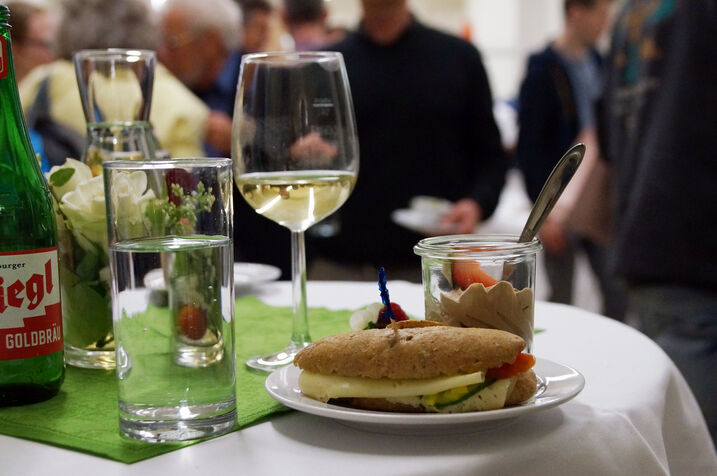 Food and drinks on a bar table.