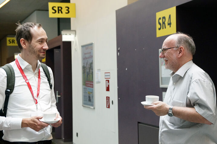 Nils Kriege and Wolfgang Klas drinking coffee.
